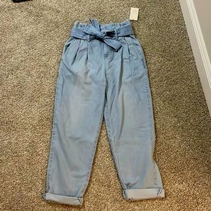 a • new day baggy, tie in the front light blue jeans